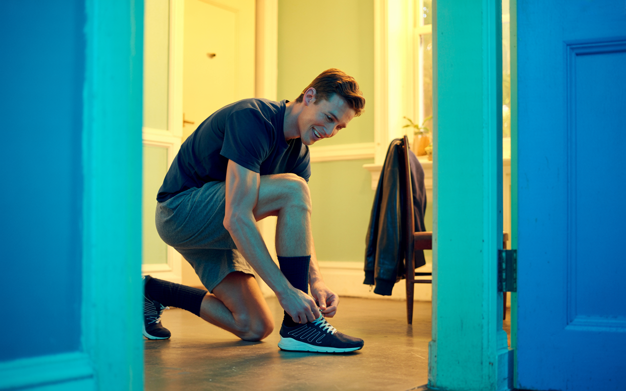 Man getting ready to go for a run after receiving guidance on his weight management journey